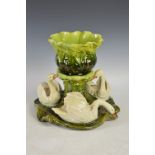 A late 19th century Bretby pottery table centrepiece, the jardiniere resting on a naturalistic