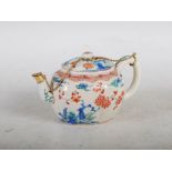 A late 18th century Japanese Kakiemon teapot and cover, the lobbed oval body decorated with