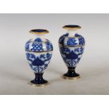 A pair of Macintyre Moorcroft Aurelian Ware pottery vases, decorated with stylised flowers and