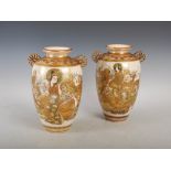 A pair of Japanese Satsuma pottery twin handled vases, Meiji Period, decorated with lohan, signed,