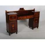 A William IV mahogany and satinwood banded sideboard, the upright gallery back centred with a