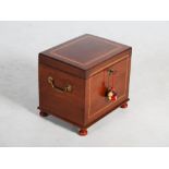 A 19th century mahogany and satinwood banded work box, the hinged rectangular top opening to a