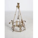A late 19th/ early 20th century gilt metal seven light chandelier, cast with rope twist frame and