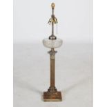 A late 19th/ early 20th century electroplated Corinthian column paraffin burning lamp converted to a