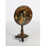 A Victorian papier mache snap top occasional table, the circular top hand painted with parrots, urns
