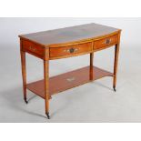 A 19th century painted satinwood bow front dressing table, the shaped rectangular top decorated with