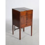 A 19th century mahogany and boxwood lined wash stand, the hinged rectangular top opening to a fitted