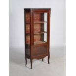 A 19th century French mahogany, gilt metal mounted and marble topped vitrine, the mottled white