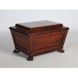 A 19th century mahogany and ebony lined sarcophagus shaped cellarette, the hinged top with gadroon