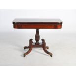 A 19th century mahogany and ebony lined tea table, the hinged rectangular top raised on a reeded