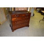 A George III mahogany chest of small size, the rectangular top with a moulded edge above two short