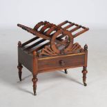 A 19th century rosewood Canterbury, with four angular and laurel carved divisions above a single