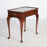 A George III mahogany silver table, the rectangular top with a slightly raised edge and re-entrant