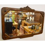 Carved oak and bevelled glass wall mirror