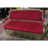 Louis XVI style gilt and upholstered salon sofa