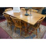 Extending pine dining table with six chairs