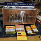 Selection of tinned cigars and stand