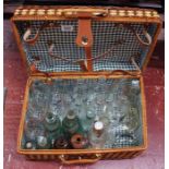 Picnic hamper with old bottles