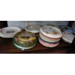 Large collection of bread plates