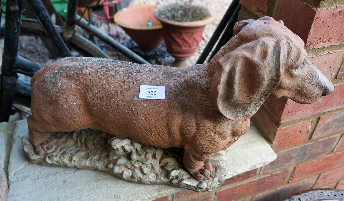 Stone sausage dog figure