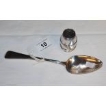 Silver spoon and silver pepper pot