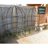 A pair of metal gazebo seats