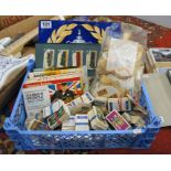 Box of assorted cigarette cards and stamps