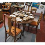 Oak wind out table and four chairs