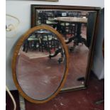 Oval and mahogany bevelled wall mirrors