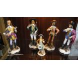 Four Musketeer figurines and one other