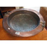 Old copper paella dish