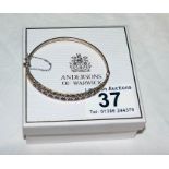 Gold garnet & diamond set bangle by Andersons of Warwick