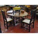 Set of four barely twist and cane oak dining chairs to include 2 carvers