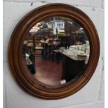 Circular oak and bevelled glass wall mirror