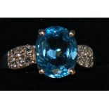 Silver and blue topaz set ring