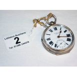 Silver pocket watch in working order with key