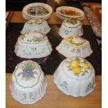 6 china jelly moulds & 7 wedgwood plates