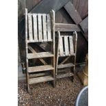 2 wooden step ladders