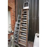 Collection of wooden and aluminium ladders