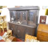 Large oak glazed top and carved cabinet