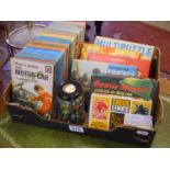 Box of children's Ladybird books, old games and marbles