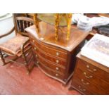 Small reproduction mahogany serpentine fronted chest of 4 drawers with slide