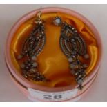 Pair of costume earrings