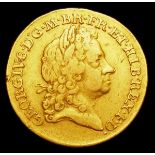 Guinea 1715 Third Laureate Head S.3630 Fine with a scratch in front of the bust, the edge milling