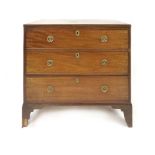 A 19th Century mahogany and ebony line inlaid chest of three graduated long drawers with brass