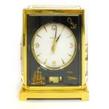 A Jaeger-Lecoultre Marina Atmos clock, the white dial with gilt numerals and batons, surrounded by