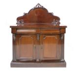 A Victorian Mahogany chiffonier, raised back with pierced and carved scrolling decoration on a