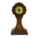 An Edwardian rosewood mantle clock with ivorine and brass dial, line inlaid and patera decoration