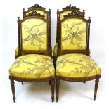 A set of four mahogany framed dining chairs with rose carved crest, tapering fluted columns flanking