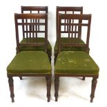 A set of four late Victorian mahogany dining chairs, moulded backrest, stuffed over seat, tapering